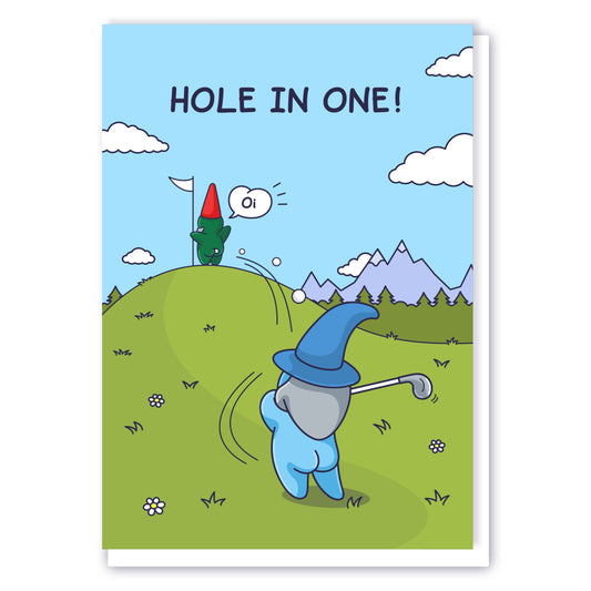 This funny greeting card features a Wizard swinging a golf ball and landing in the bum cheeks of a Gnome who is holding a golf flag on the green. The caption reads 'Hole in One' and the Gnome is shouting 'Oi!'