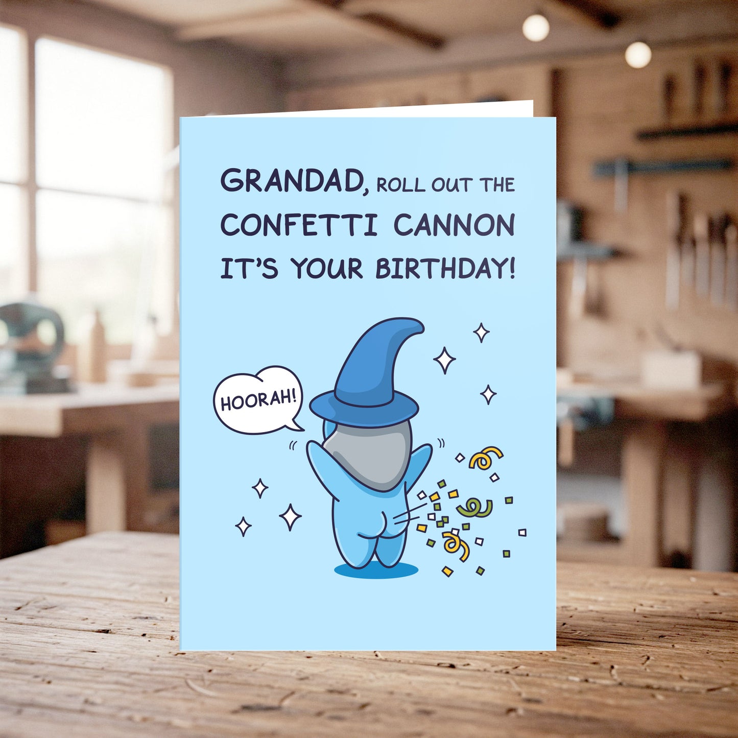 Birthday card with wizard illustration and text on a wooden table