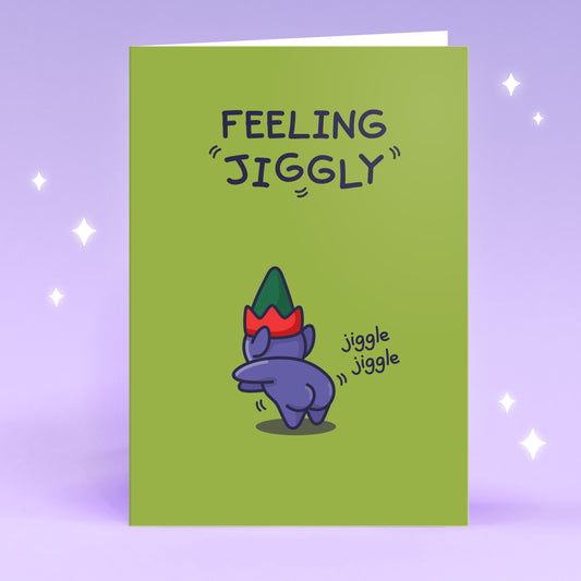 A whimsical greeting card titled ‘Feeling Jiggly’ from the Cheeky Legends. It features a cute elf jiggling his bum in a sense of happiness.