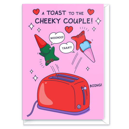A cute gnome couple are leaping out of a toaster. The funny title reads 'A Toast to the Cheeky Couple!'