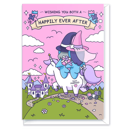 A gorgeous greeting card features a beautiful castle and a newly wedded couple riding together on a unicorn. There is a banner with the message 'Wishing you both a Happily Ever After'.