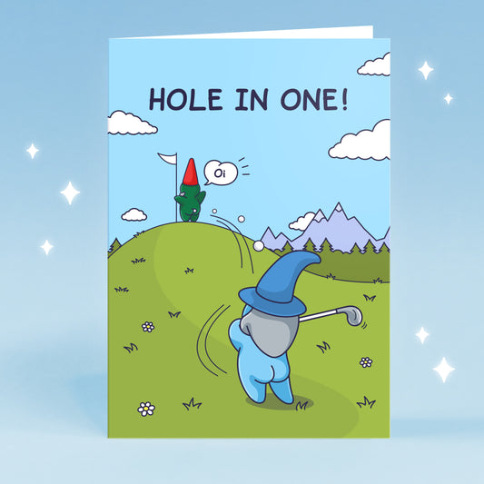 This funny greeting card features a Wizard swinging a golf ball and landing in the bum cheeks of a Gnome who is holding a golf flag on the green. The caption reads 'Hole in One' and the Gnome is shouting 'Oi!'