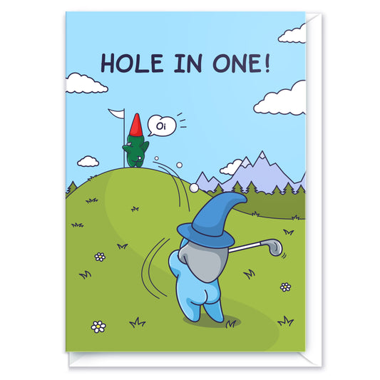 This funny greeting card features a Wizard swinging a golf ball and landing in the bum cheeks of a Gnome who is holding a golf flag on the green. The caption reads 'Hole in One' and the Gnome is shouting 'Oi!'