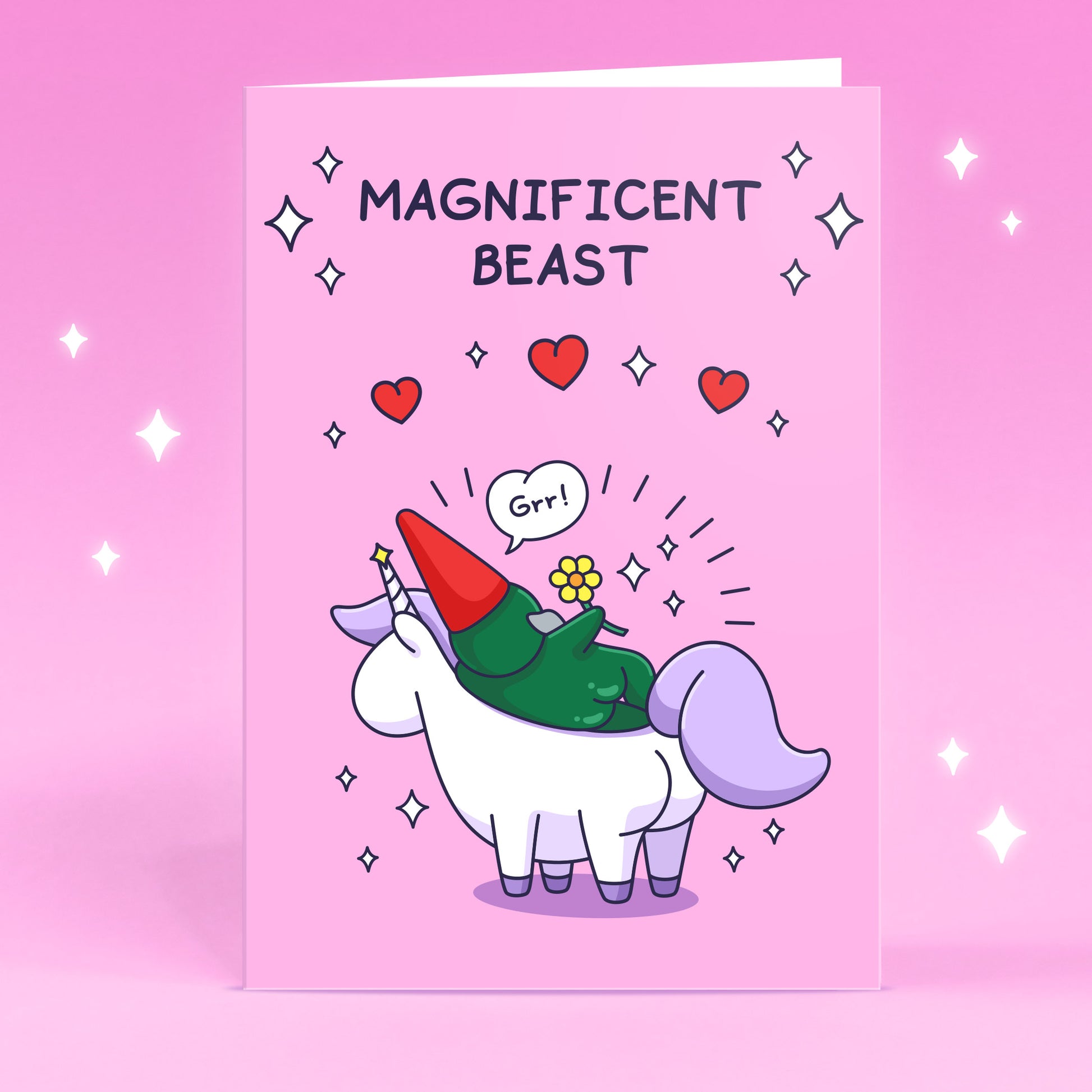 A cheeky gnome is laying on a unicorn with flowers, sparkles and hearts. This beautiful card has the caption 'Magnificent Beast'.