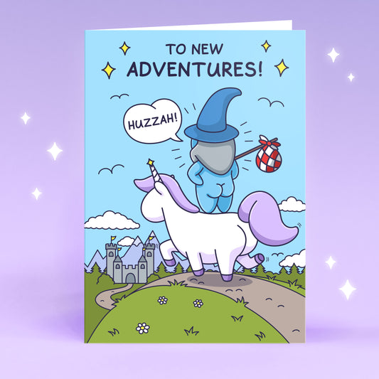 A cheeky wizard is riding a beautiful unicorn towards a castle. The caption reads 'To New Adventures'. Funny greeting card.